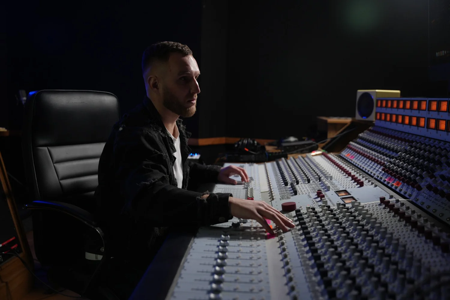 Sound engineer at the large console in the Master Room